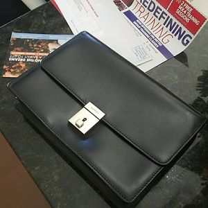 Vintage black leather Gucci clutch.